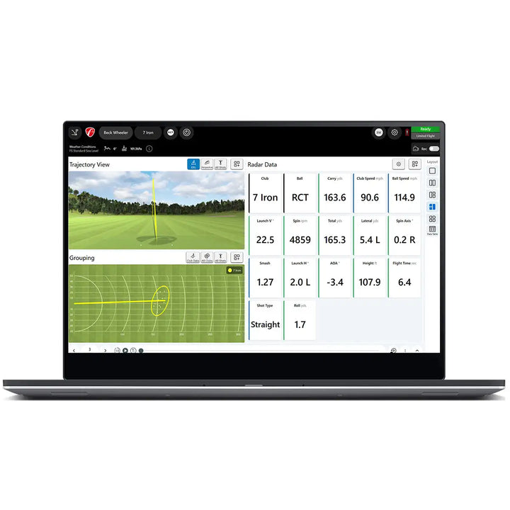 A laptop displaying golf swing analysis software with trajectory and grouping views, radar data, and shot metrics on the screen.